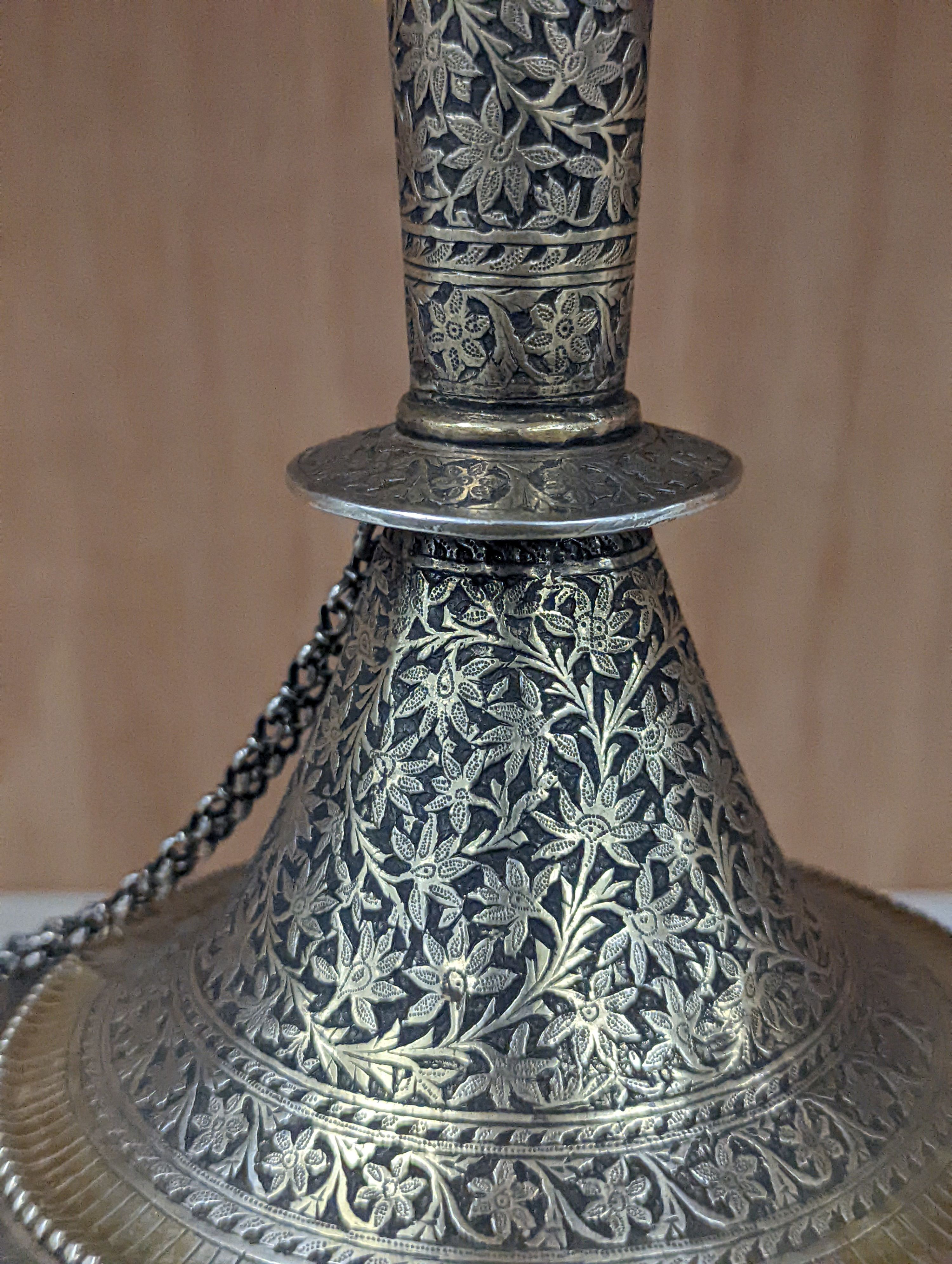 A 19th century North Indian silver surahi with engraved shawl decoration 30cm